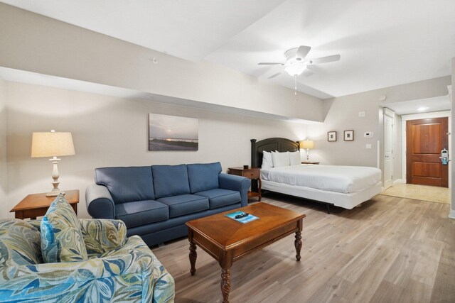 bedroom with ceiling fan and light hardwood / wood-style flooring