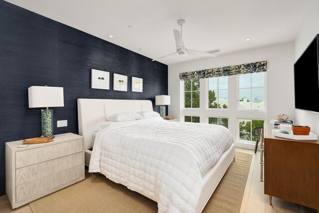 bedroom featuring ceiling fan and light tile patterned flooring