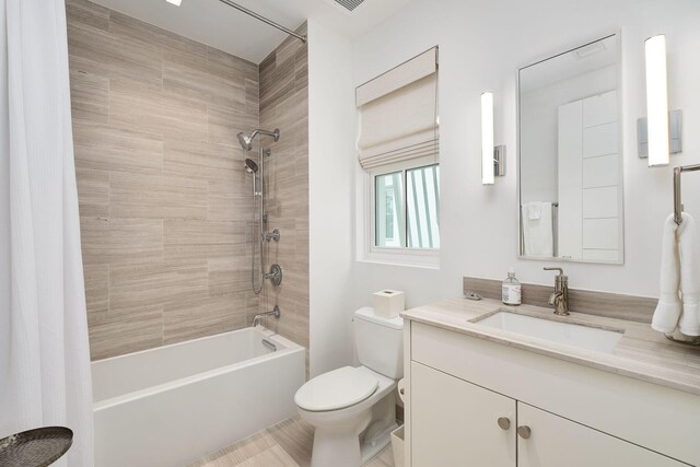 full bathroom featuring vanity, toilet, and shower / tub combo with curtain