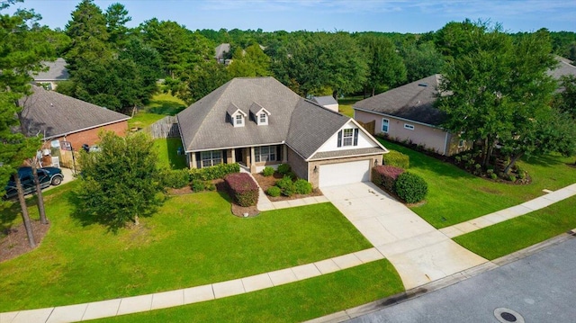 exterior space featuring a garage and a front lawn