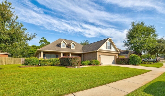 view of front of home with a garage and a front yard