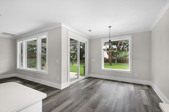 601 Third Ave, Destin, FL 32541 - unfurnished dining area with plenty of natural light, visible vents, dark wood-style flooring, and ornamental molding