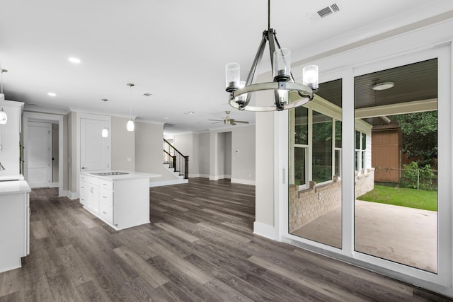 601 Third Ave, Destin, FL 32541 - kitchen featuring light countertops, white cabinets, ceiling fan with notable chandelier, and visible vents