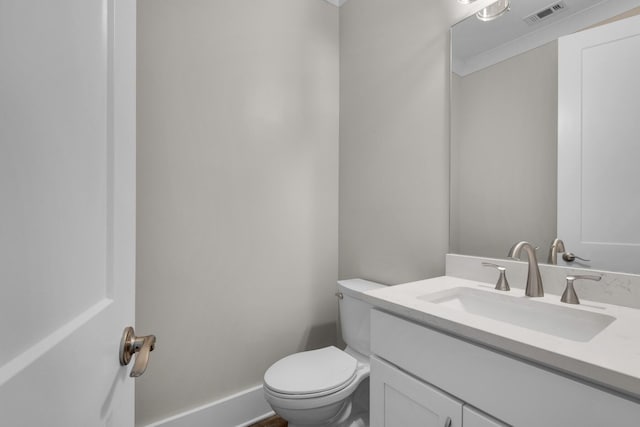 601 Third Ave, Destin, FL 32541 - half bathroom featuring vanity, toilet, and visible vents