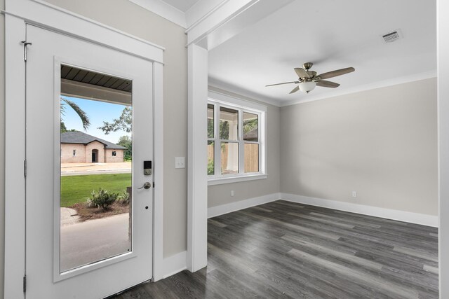 foyer entrance with crown molding, dark wood-type flooring, and ceiling fan