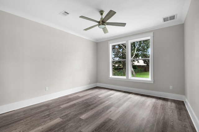 unfurnished room featuring ceiling fan, dark hardwood / wood-style flooring, and ornamental molding