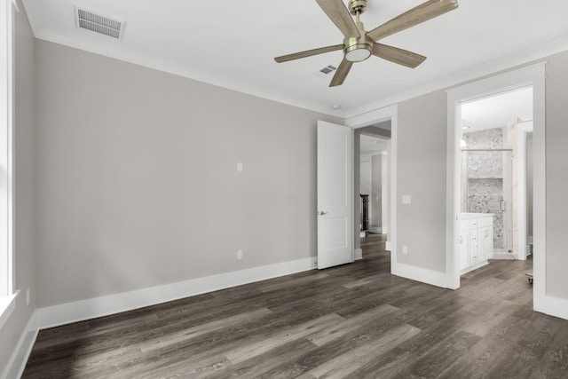 unfurnished bedroom featuring ceiling fan, dark hardwood / wood-style floors, connected bathroom, and ornamental molding