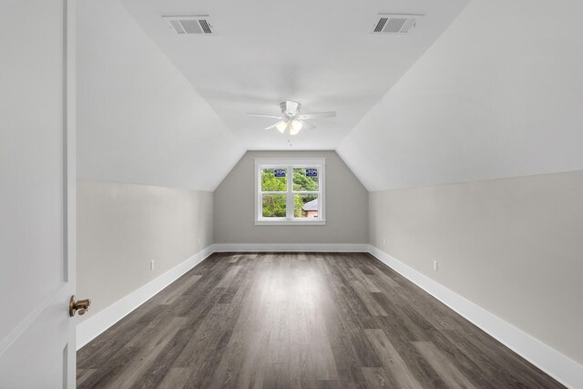 bonus room with lofted ceiling, ceiling fan, and dark hardwood / wood-style floors