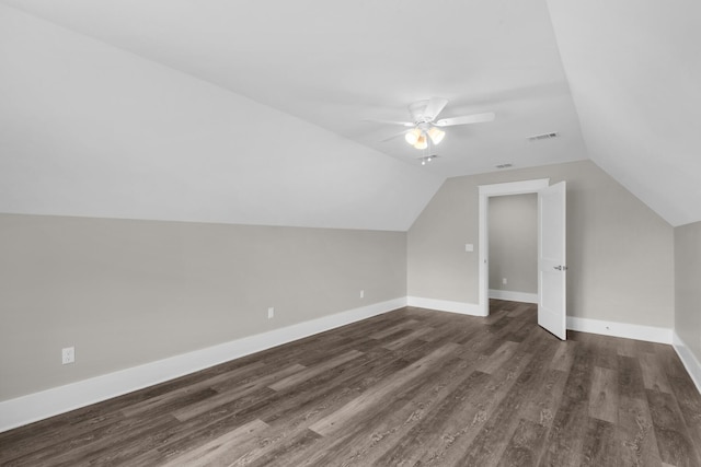 601 Third Ave, Destin, FL 32541 - bonus room featuring visible vents, baseboards, dark wood-type flooring, and vaulted ceiling
