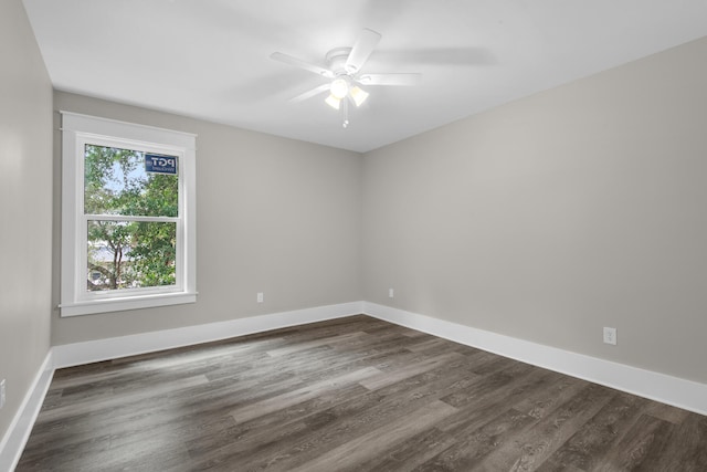 unfurnished room with ceiling fan, dark hardwood / wood-style flooring, and a healthy amount of sunlight