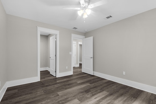 601 Third Ave, Destin, FL 32541 - unfurnished bedroom featuring visible vents, baseboards, dark wood-style floors, and a ceiling fan