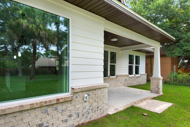 exterior space featuring a yard and a patio area