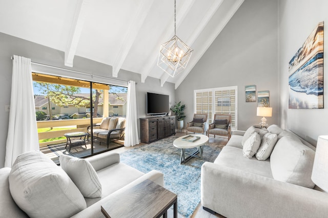 living room featuring high vaulted ceiling, beam ceiling, a notable chandelier, and a healthy amount of sunlight