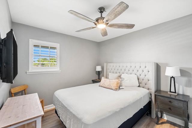 bedroom featuring dark wood-type flooring and ceiling fan