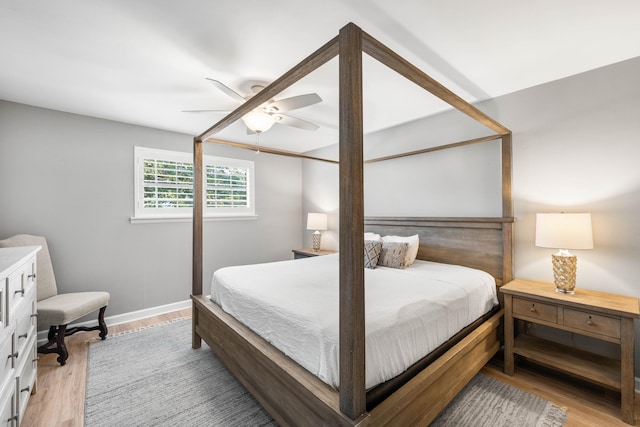 bedroom with light wood-type flooring and ceiling fan