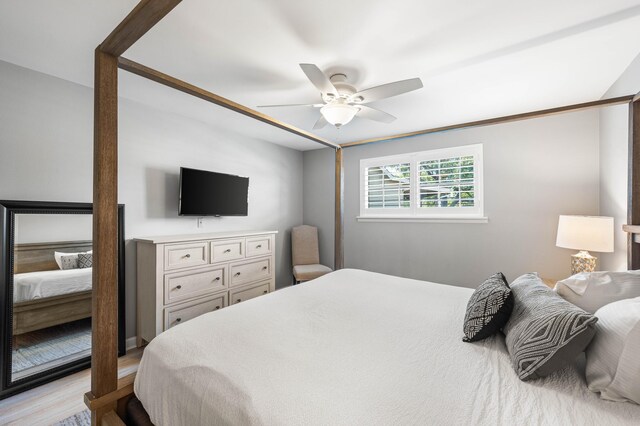 bedroom with light hardwood / wood-style flooring and ceiling fan