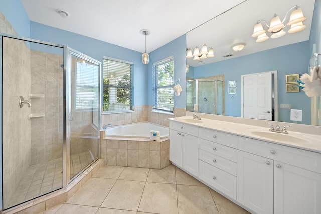 full bath featuring tile patterned floors, a stall shower, a sink, double vanity, and a bath