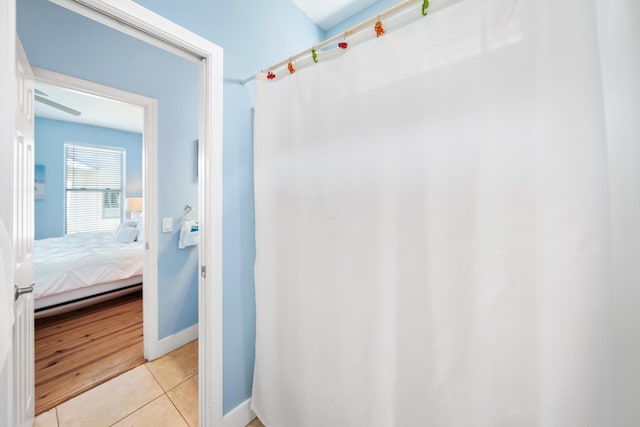 bathroom featuring tile patterned floors and baseboards