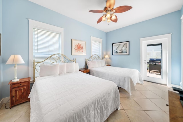 bedroom featuring light tile patterned floors, baseboards, a ceiling fan, and access to exterior