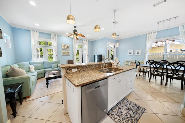 kitchen featuring visible vents, ceiling fan, dishwasher, light tile patterned flooring, and a sink