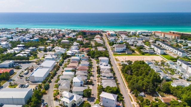 birds eye view of property with a water view and a residential view