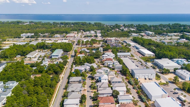 drone / aerial view with a residential view and a water view