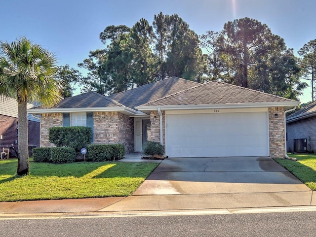 ranch-style home with a garage and a front yard