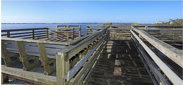 dock area with a water view