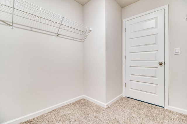 6324 Firefly Dr, Milton, FL 32583 - walk in closet featuring carpet