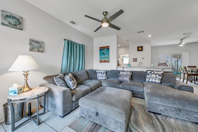 living room featuring ceiling fan and light tile patterned floors