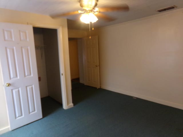 unfurnished bedroom with carpet flooring, a closet, and ceiling fan