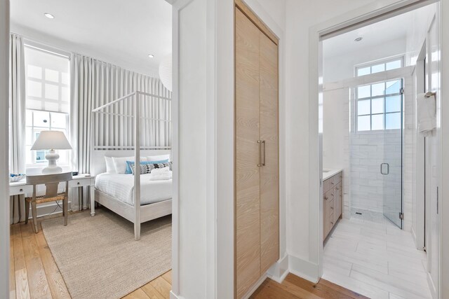 bedroom featuring light hardwood / wood-style flooring and a closet