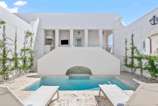 view of pool with a patio and ceiling fan