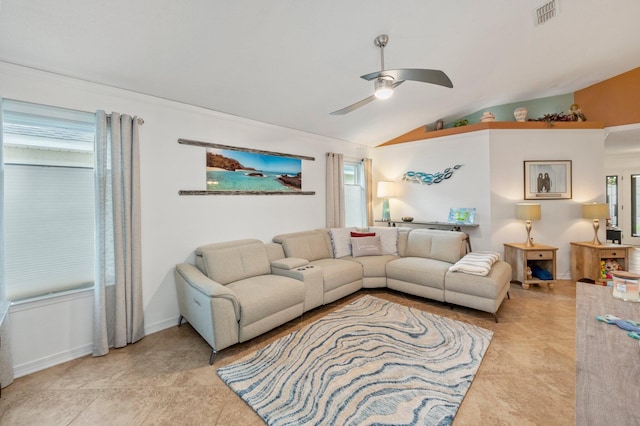 living room featuring a healthy amount of sunlight, ceiling fan, vaulted ceiling, and light tile patterned flooring