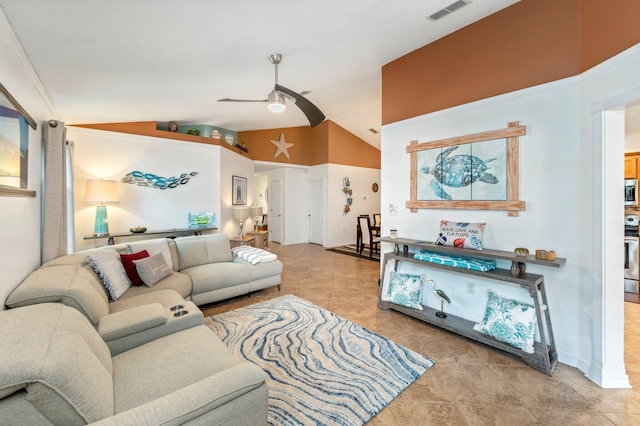 living room featuring light tile patterned flooring, lofted ceiling, and ceiling fan