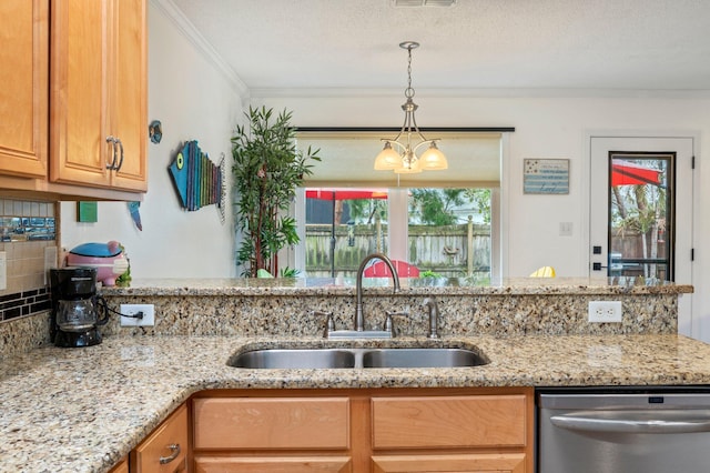 kitchen featuring dishwasher, sink, crown molding, and plenty of natural light