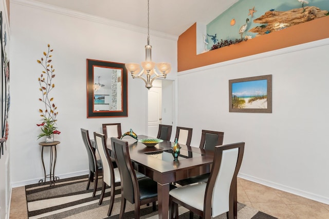 tiled dining room with a notable chandelier and ornamental molding