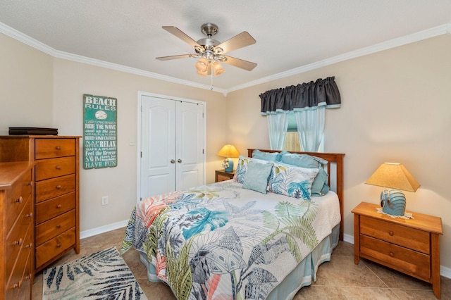 tiled bedroom with ceiling fan, a textured ceiling, a closet, and ornamental molding