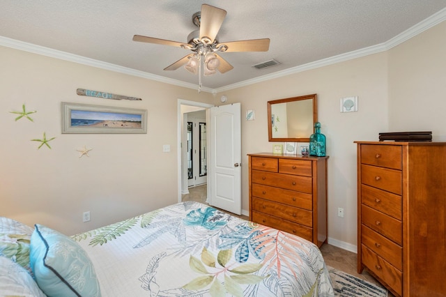 carpeted bedroom with ornamental molding, a textured ceiling, and ceiling fan