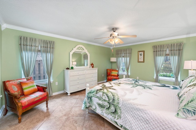 bedroom featuring ceiling fan, a textured ceiling, and ornamental molding