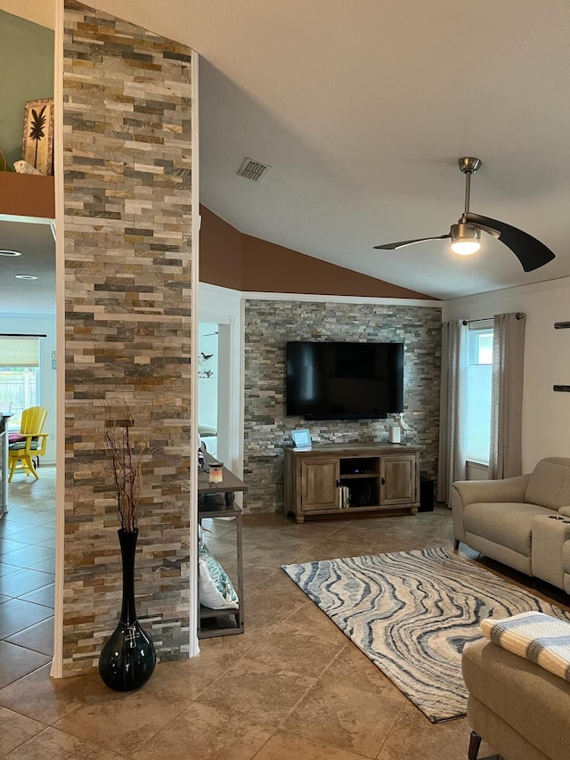 unfurnished living room with tile patterned flooring, lofted ceiling, and ceiling fan