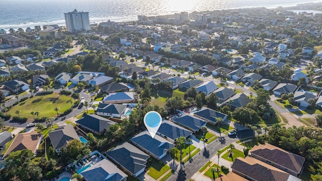 aerial view featuring a view of the beach and a water view