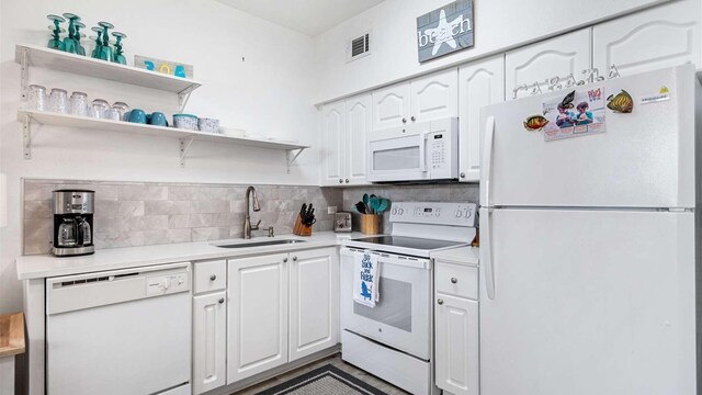 kitchen with white cabinets, white appliances, decorative backsplash, and sink