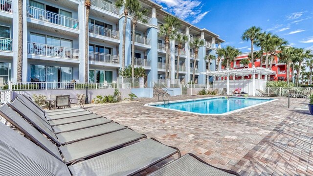 view of swimming pool featuring a patio