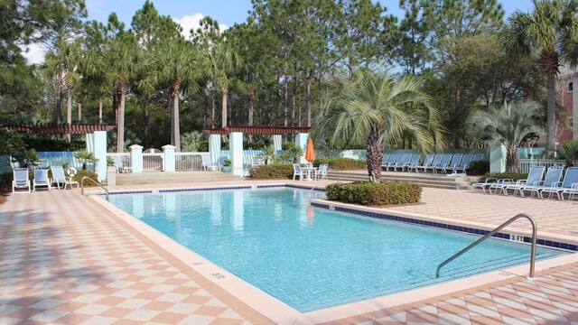 view of swimming pool with a pergola and a patio area