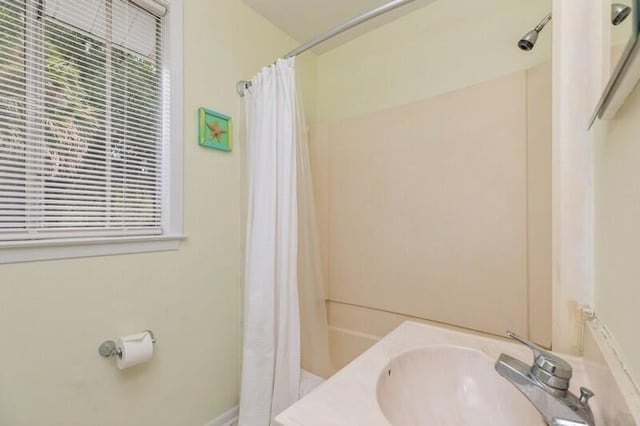 full bathroom with a sink and a shower with curtain