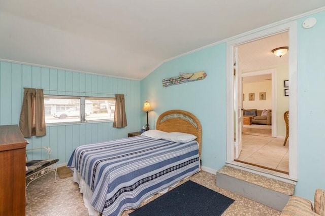 bedroom featuring lofted ceiling