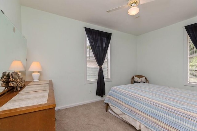 bedroom featuring a ceiling fan, baseboards, and carpet floors