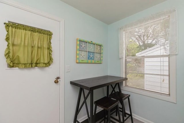 dining space featuring baseboards