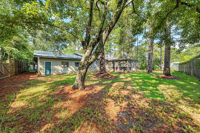 view of yard featuring a sunroom